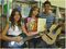 Os alunos Joice, Rafaela, e Wesley aprenderam a música La Bamba por meio de um livro.
