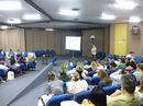 Professores sentados em auditório